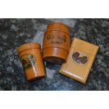 Group of Mauchline ware including glass shot glass holder, card case and barrel shaped money box