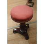 A Victorian adjustable upholstered mahogany stool.