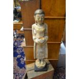 A carved and painted wooden Oriental figure, approx 75 cms in height