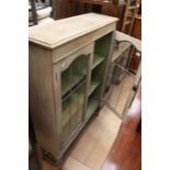 ***AWAY***A  bleached wood glazed cabinet.