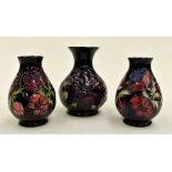 Three late 20th Century blue ground Moorcroft vases