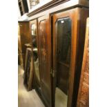 **AWAY** Late Victorian mahogany three door wardrobe, mirrors either side