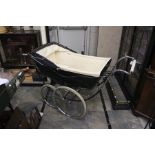 A Marmet Britannia pram, detachable body, cream interior, measuring approx 145cm length, 95cm wide.