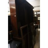 Large mahogany glazed bookcase with a solid four door  base unit together with a vitrine.