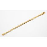 A 14k gold bracelet, comprising fancy textured links, length approx 7.5'', weight approx 11.6gms