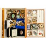 A collection of costume jewellery to include vintage brooches, gilt metal bangles, bracelets,