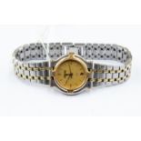 **REOFFER IN A&C NOV £40-£60** A ladies Gucci steel gold-plated bracelet watch, gold tone round