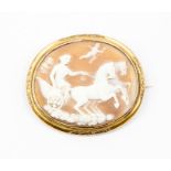 A 19th Century shell cameo brooch, depicting Greek goddess, oval with unmarked yellow metal