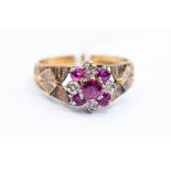 A 9ct gold ruby and diamond cluster ring, engraved detail to shoulders, size O, total gross weight