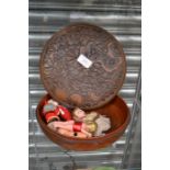 A turned and carved circular treen vessel together with celluloid and other Christmas decorations (