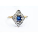 An Art Deco  sapphire and diamond ring, diamond shaped platinum setting, set to the centre with a