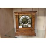 A 1930's 8 day strike oak cased mantel clock and a similar 1930's quartz movement oak cased mantel