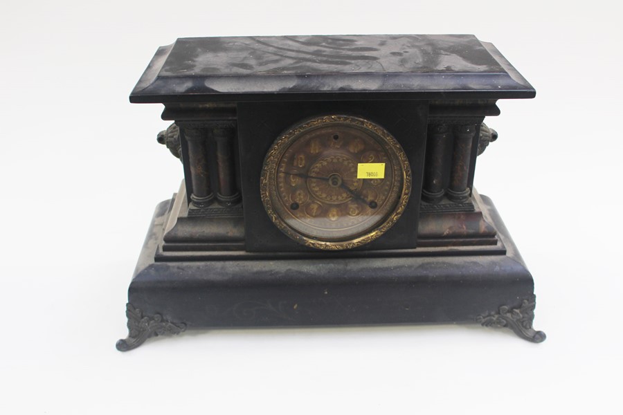 **AWAY** A French revival 19th Century style ebonised and gilt metal clock, carved pillars on