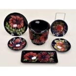 Collection of blue ground Moorcroft pin dishes, dishes and small planter, late 20th Century