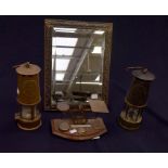 Two vintage brass miners lamps, Victorian postal scales and brass mirror