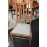 Four early 20th Century dining chairs with padded seats