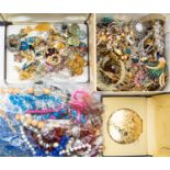 A large collection of costume jewellery to include vintage paste set brooches, enamel bird brooches,