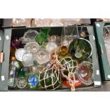 A collection of glassware including various Continental tourist ware; paperweights, vases, salts,