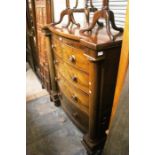 A Victorian , mahogany bow fronted chest of drawers, two short over three long,decorated with