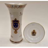 Reproduction Chinese export vase with coat of arms along the side and a Ralph Lauren Polo plate made