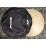 Five cymbals from a drum-kit, along with the carry case