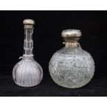 Two silver topped cut glass perfume bottles, Birmingham hallmark
