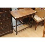 ***AWAY*** A 20th Century oak hall table, fitted with two short drawers on turned supports.