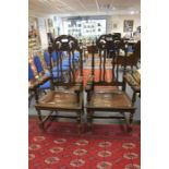 A pair of 19th century Gothic Revival oak carved halls, leather inlay arm rest and seating area,