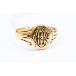 An 18ct gold seal ring, oval shape, monogramed, size Q, total gross weight 5.5gms