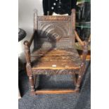 A 17th Century oak carved wainscot chair, circa 1690. carved panel back, raised on turned flute