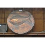 A Newlyn school style Arts and Crafts copper circular fish plaque