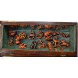 A selection of fruitwood Netsukes depicting a variation of animals to include; fish, cats, horses,