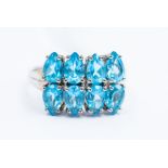 A blue topaz and 9ct white gold ring, comprising two rows of pear cut blue topaz , four stones