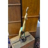 An Art Deco style female figure in painted brass, approx 52 cms in height