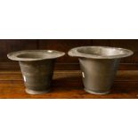Two early 18th Century pewter vessels, each in the form of a Welsh top hat, graduated in size
