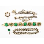 A collection of costume jewellery to include a white metal fancy link chain and a charm bracelet