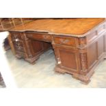 **VH - CH 30/10/19 REOFFER IN A&C NOV £300-£400** A late 20th century carved mahogany pedestal desk,