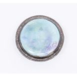 A pewter and Ruskin Pottery circular brooch