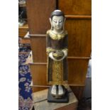 A carved and painted wooden Oriental figure, approx 69 cms in height