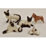 A Beswick collection to include; Siamese cat, pattern number 1559; a Siamese cat lying down, pattern