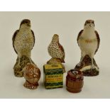 A collection of Beswick whisky flasks in the shape of birds of prey (Q)