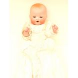 Am German baby doll in christening style gown