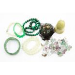 **AWAY** A collection of costume jewellery including jade, glass and an onyx egg