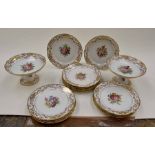 A hand painted Sevres dessert service with floral bouquet to the centre and gilt edges, two comports