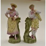A pair of Continental vases/statues lady and gentleman in traditional dress, approx 32 cms high A/F
