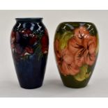 Two Moorcroft vases, both marked and signed by W. Moorcroft to the base, one in the Hibiscus