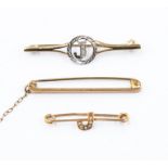 Three bar brooches to include a 9ct gold version with the initial J diamond set along with a 9ct bar