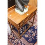 A mid 20th Century canteen of cutlery in an oak dining room stand with barley twist legs