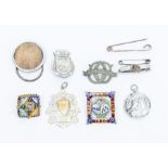 A silver bullet brooch, brooches, medallions and a micro mosaic brooch and football medal