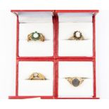 A collection of four 9ct gold rings, including opal, sapphire, diamond, emerald and malachite